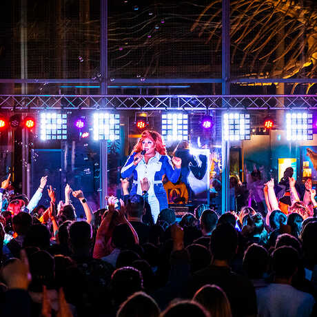 Pride drag show emcee and crowd