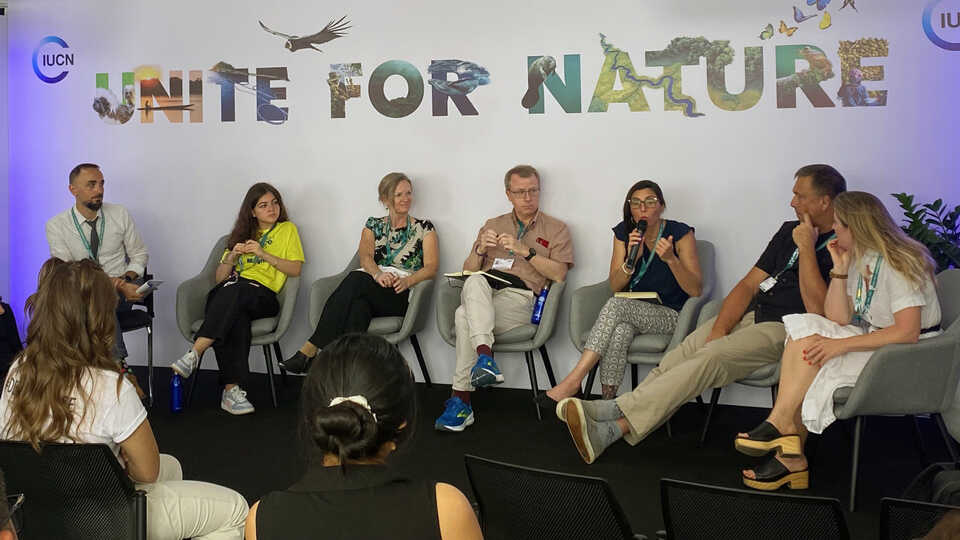 Estefanía Pihen González (third from right) speaks on a panel on the importance of biodiversity education at COP 16.