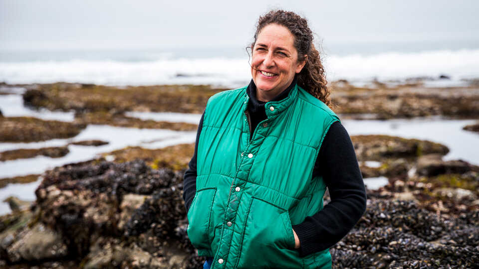 Rebecca Johnson, director of Cal Academy Center for Biodiversity and Community Science, stands near tidepools in San Mateo, California
